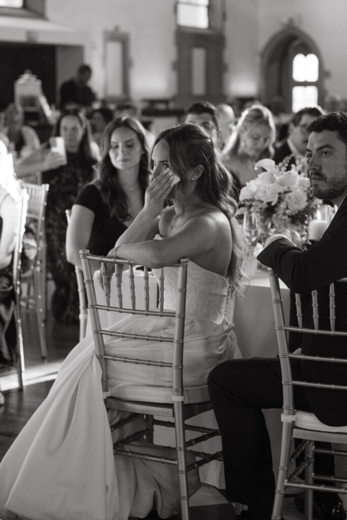Bride wipes away tears during heartfelt reception speeches at The Palomar, one of our favorite Ohio wedding venues.