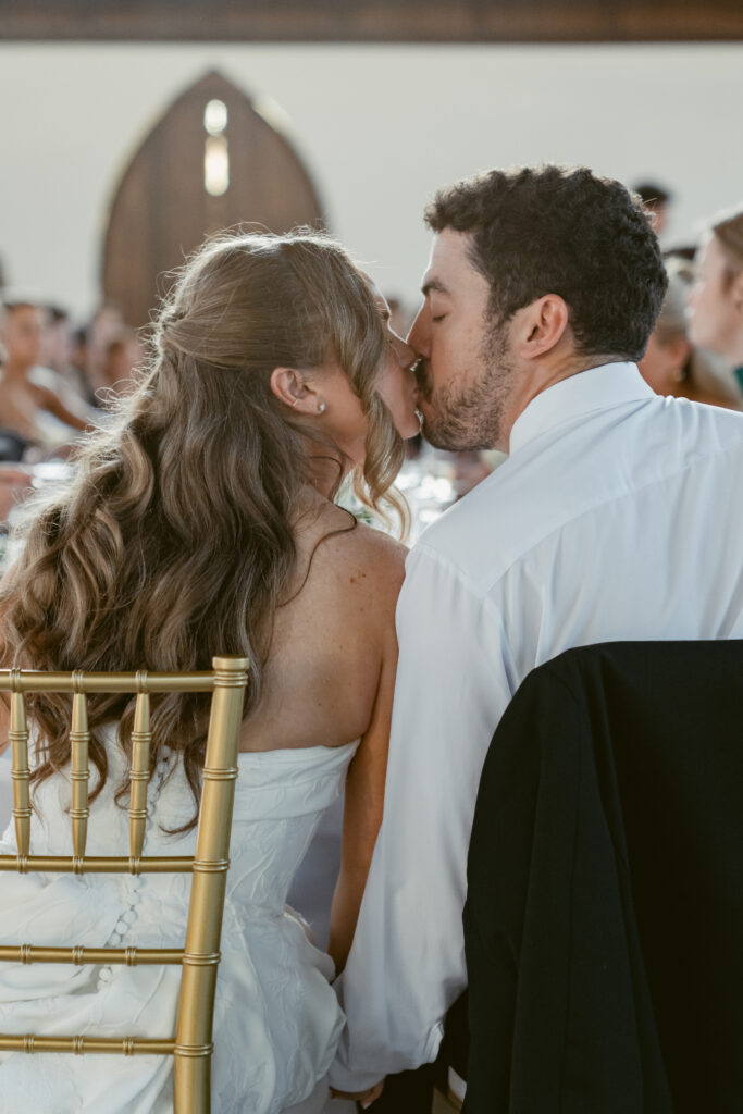Bride and groom share a sweet kiss during the reception at The Palomar