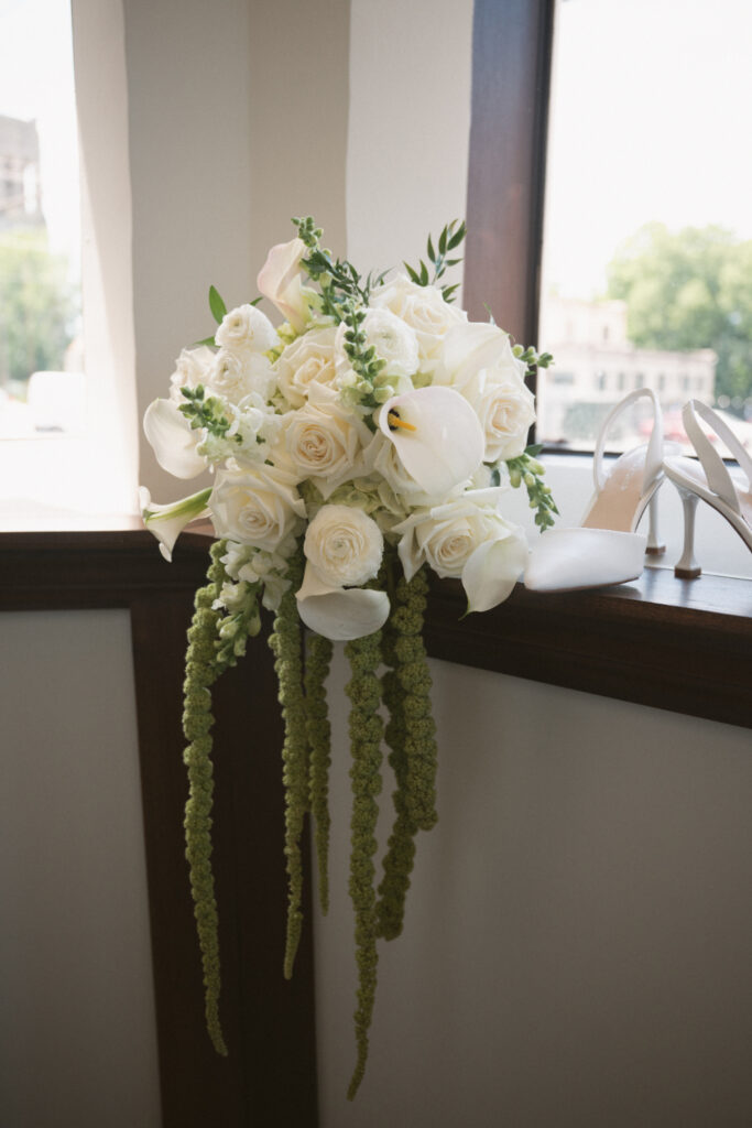 White rose and calla lily bouquet displayed at The Palomar, one of our favorite Ohio wedding venues.