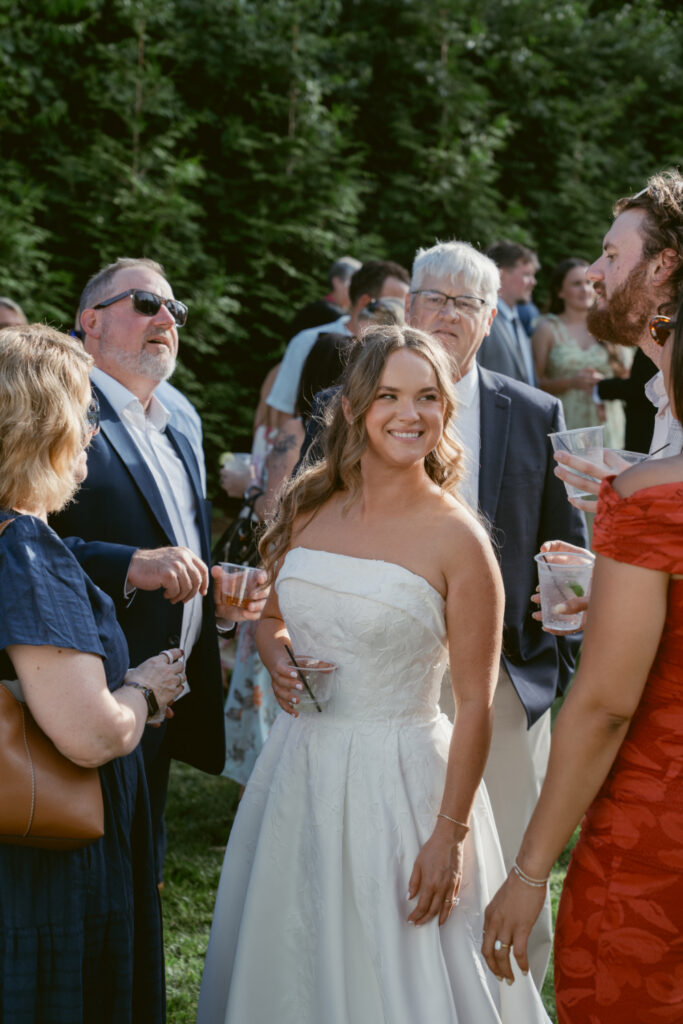 Bride visits with family and friends during cocktail hour at The Palomar, one of our favorite Ohio wedding venues.